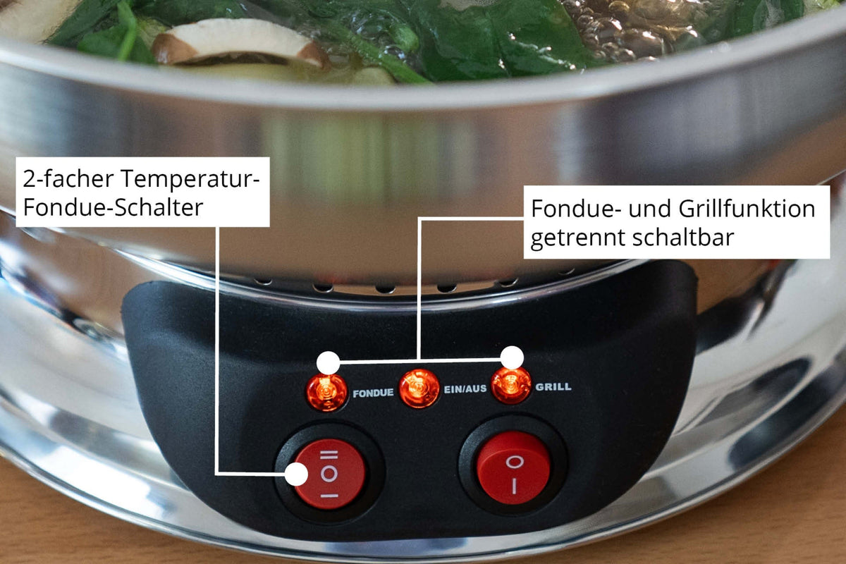 Nahaufnahme des Unold Asia-Fondue-Topfes mit beschrifteten Knöpfen und Leuchten für separate Fondue- und Grillfunktionen sowie einem Doppeltemperaturschalter. Im Topf kocht Gemüse im Wasser.