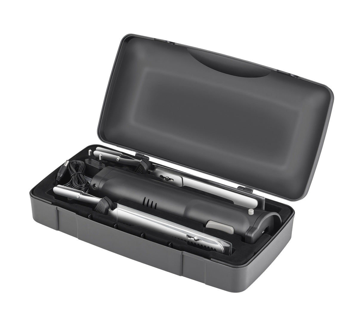 Das Unold Elektromesser Cordless wird in einem schwarzen Kunststoffkoffer mit Schaumstoffeinlage geliefert und verfügt über einen Hauptgriff, verschiedene Aufsätze und ein Netzkabel für vielseitiges elektrisches Haarstyling.