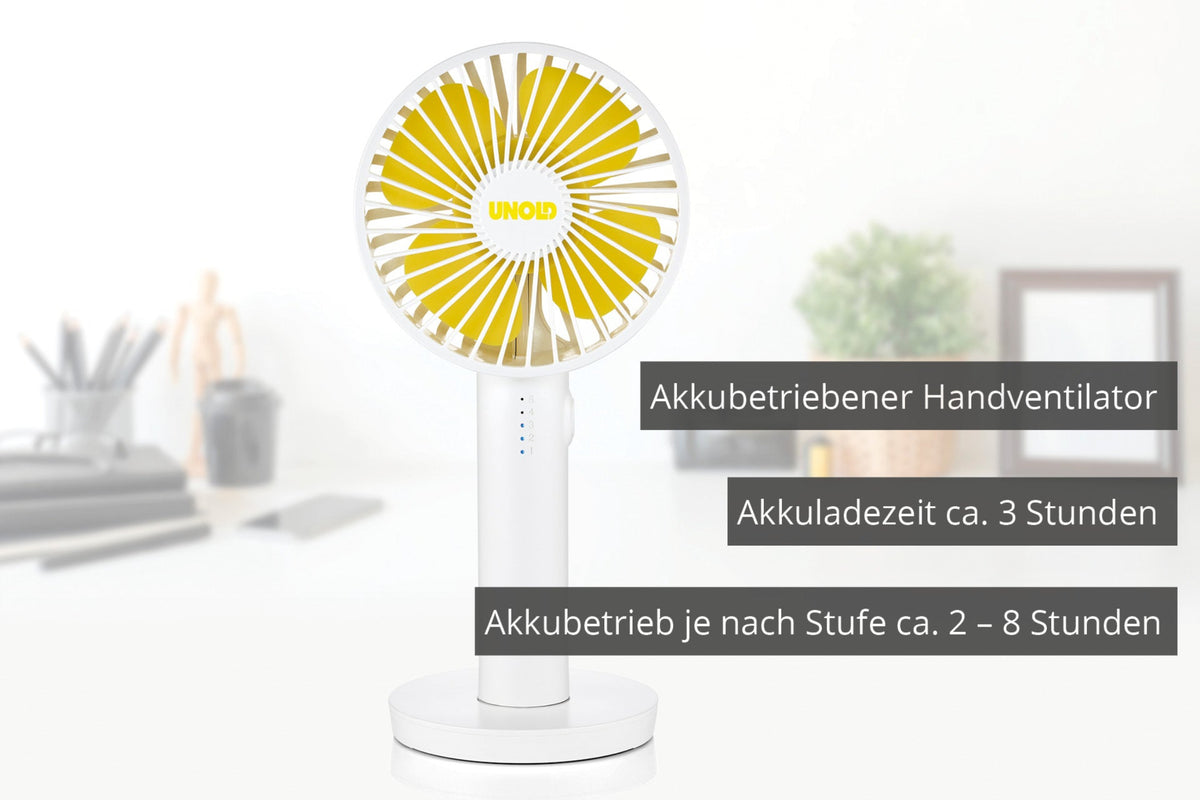 Der weiß-gelbe Unold Handventilator Breezy II steht auf einem Schreibtisch. Der deutsche Text weist auf den Batteriebetrieb, die Ladezeit von 3 Stunden und die Laufzeit von 2–8 Stunden (je nach Einstellung) hin.