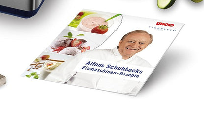 Das Cover zeigt Alfons Schuhbeck im weißen Kochmantel lächelnd, mit Bildern von Eis, Smoothie und Dessert. Titel: „Alfons Schuhbecks Eismaschinen-Rezepte.“ Oben ist das Unold-Logo. Produkt: Eismaschine Schuhbeck Exklusiv 1,5 L B-Ware.