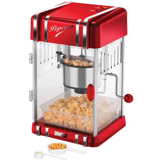 Der Unold Popcornmaker Retro ist eine rot-silberne Popcornmaschine mit transparenter Tür, einer Popcornkammer aus Metall und einem mit Popcorn gefüllten Tablett. Vorne befinden sich ein Messlöffel und ein kleiner Becher mit Popcornmais.
